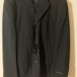Brand new with tags black wool suit from Vittorio St Angelo. 48L jacket 42 pants